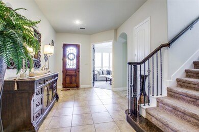 Foyer with light tile floors