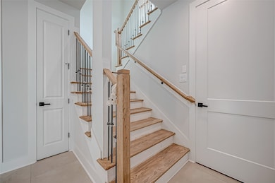 This photo showcases a modern staircase with woode