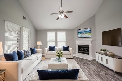 Living room features a corner fireplace. Virtually