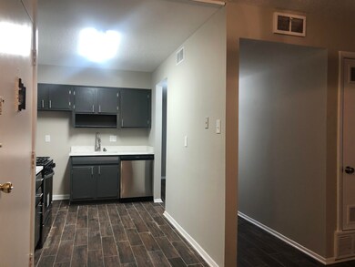 Kitchen featuring stainless steel appliances, a si