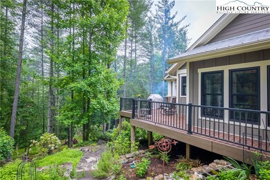 Peaceful side porch overlooking the woods. A great