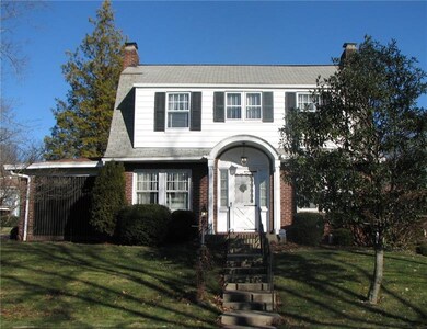 Walkway leads to the front door.