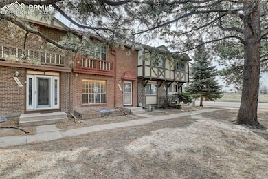 View of front of property featuring brick siding
