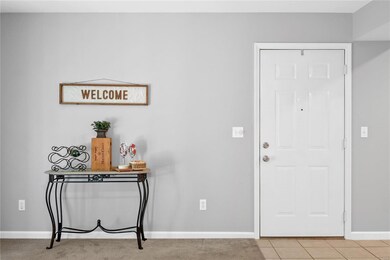 Spacious floor plan with front door opening into t