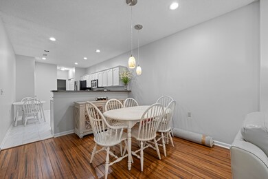 Dining room with baseboards, recessed lighting, and wood finished floors