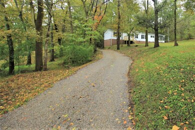 The gentle curving driveway invites you home everyday.