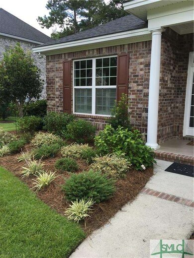 By front door. Full sprinkler system in whole yard