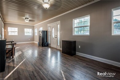 The multi-purpose front room could be an office or