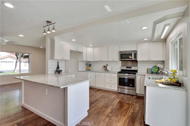 Spectacular remodeled kitchen! Brand new! Shaker cabinets with soft close doors and drawers, a lazy susan in each corner of back wall and a pull out spice rack next to range