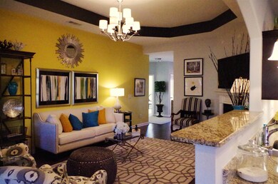 As you can see the one area highlighted with a cool yellow color and the bar over hang from the kitchen.    Also opens into dining area.