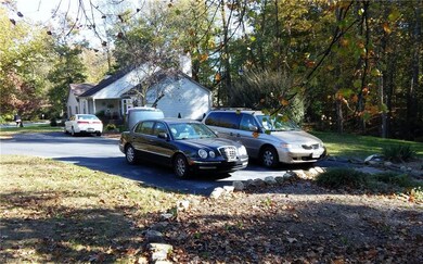 Paved parking next to home.