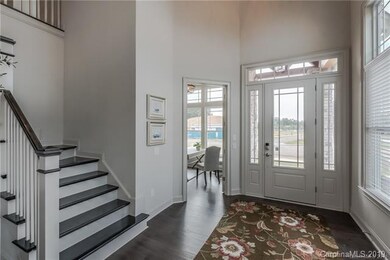 Entryway looking at the front door and office