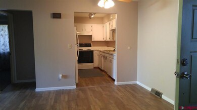Dining area to kitchen.  Inside pictures are of Un