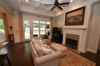 Great Room with coffered ceilings, gas fireplace &