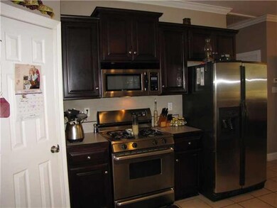 Kitchen. Pretty cherry cabinets and stainless stee