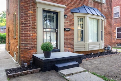 Entrance to property with brick siding