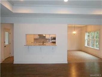 VIEW FROM GREAT ROOM TO KITCHEN AND BREAKFAST BAR