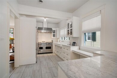Gorgeous kitchen with marble counters, stainless a