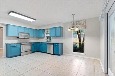 Kitchen with access door to rear yard.