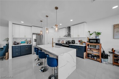 Kitchen featuring decorative backsplash, wall chim