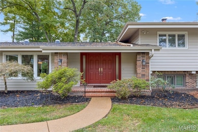 Entrance to property with brick siding