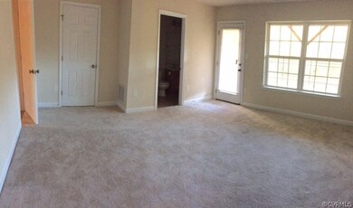 Lower level bedroom with full bath and access to outside.  This room could be used for multiple purposes, excellent for a den, room mate, office, pool table, in-law suite....