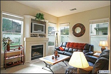 Living room with fireplace & media niche.