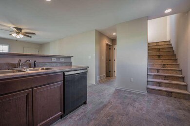 Kitchen to half bath and stairs