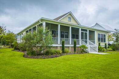 AT BACK OF HOME IS A WRAP SCREENED PORCH
