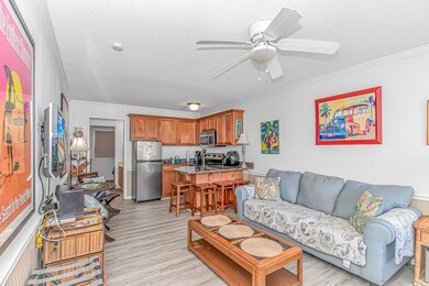Living area featuring a textured ceiling, ceiling 