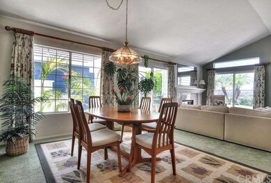 The formal dining area is open to views outside.