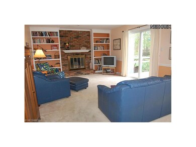 Cozy family room is warmed by the wood burning fir