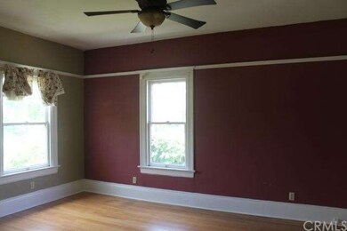 Well-lighted living room, with tall ceilings and h