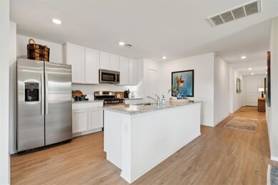Kitchen featuring light wood-style floors, visible