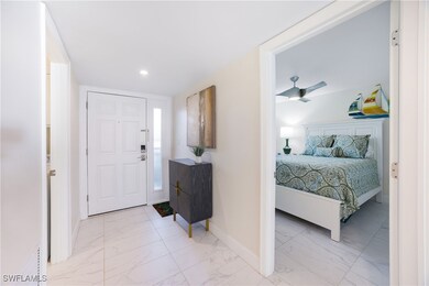 Bedroom featuring light marble finish flooring and recessed lighting