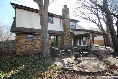 This house has a large fenced backyard with a cove