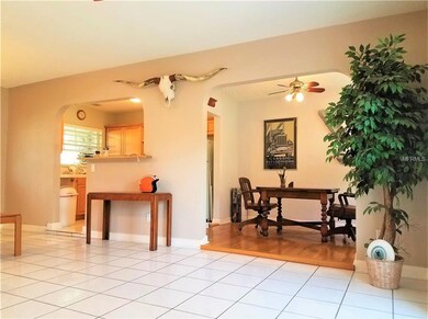 The dining room sits neatly past the kitchen with 