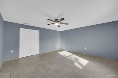 Unfurnished bedroom with a ceiling fan, a closet, and light wood-style floors