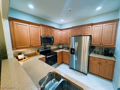 Kitchen with recessed lighting, light tile pattern