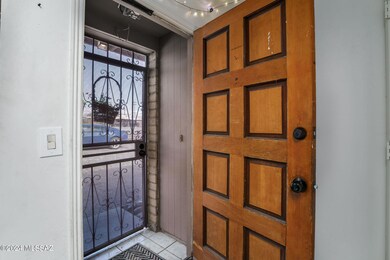 Entry with wrought iron door