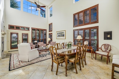 Dining room featuring a high ceiling, a ceiling f