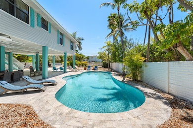 Deck surrounds pool area for lounging
