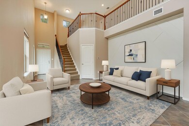 Tiled living room featuring a high ceiling, stair