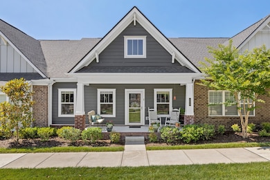 Front Porch Overlooks grassy courtyard & landscaping, all overseen by HOA!