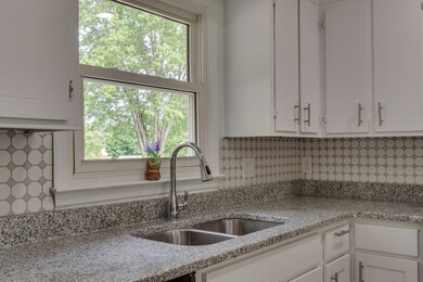 13x11 Renovated Kitchen has new appliances and custom tile work.