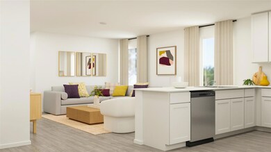 Kitchen featuring a peninsula, a sink, open floor 