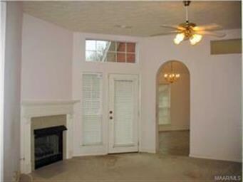 Warm cozy fireplace, archway to kitchen, and Trans