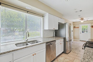Kitchen featuring backsplash, stainless steel appl