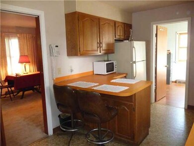 Kitchen. Kitchen with breakfast bar.  Bedroom off 