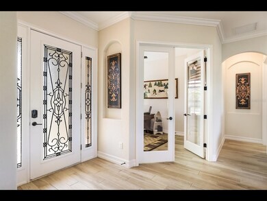 Stunning entry to spacious foyer with architectura